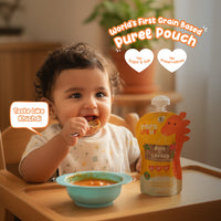 Baby eating Rorosaur Rice O Lentils puree that tastes like khichdi, made with no sugar, salt, or preservatives.