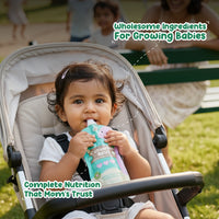Baby sipping Rorosaur Cucumber Basil puree outdoors showing wholesome ingredients and complete nutrition mothers trust.